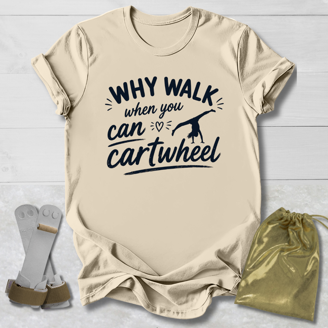Beige t-shirt with 'Why walk when you can cartwheel' text, socks, and drawstring bag on a light wooden surface.