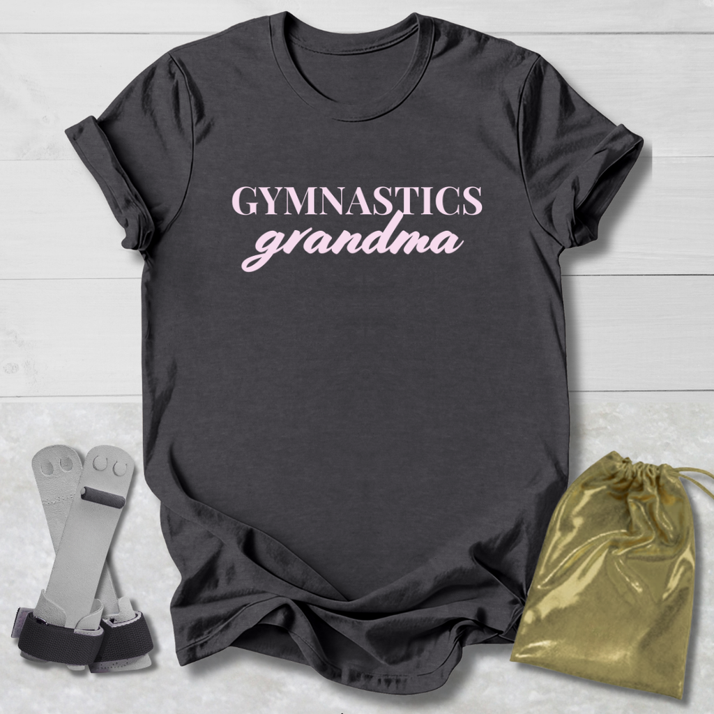 Dark gray t-shirt with 'Gymnastics grandma' text, socks, and drawstring bag on a light wooden surface.