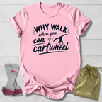 Pink -shirt with 'Why walk when you can cartwheel' text, socks, and drawstring bag on a light wooden surface.