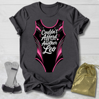 Gray t-shirt with a funny gymnastics leotard  graphic and text, socks, and a drawstring bag on a light wooden surface.