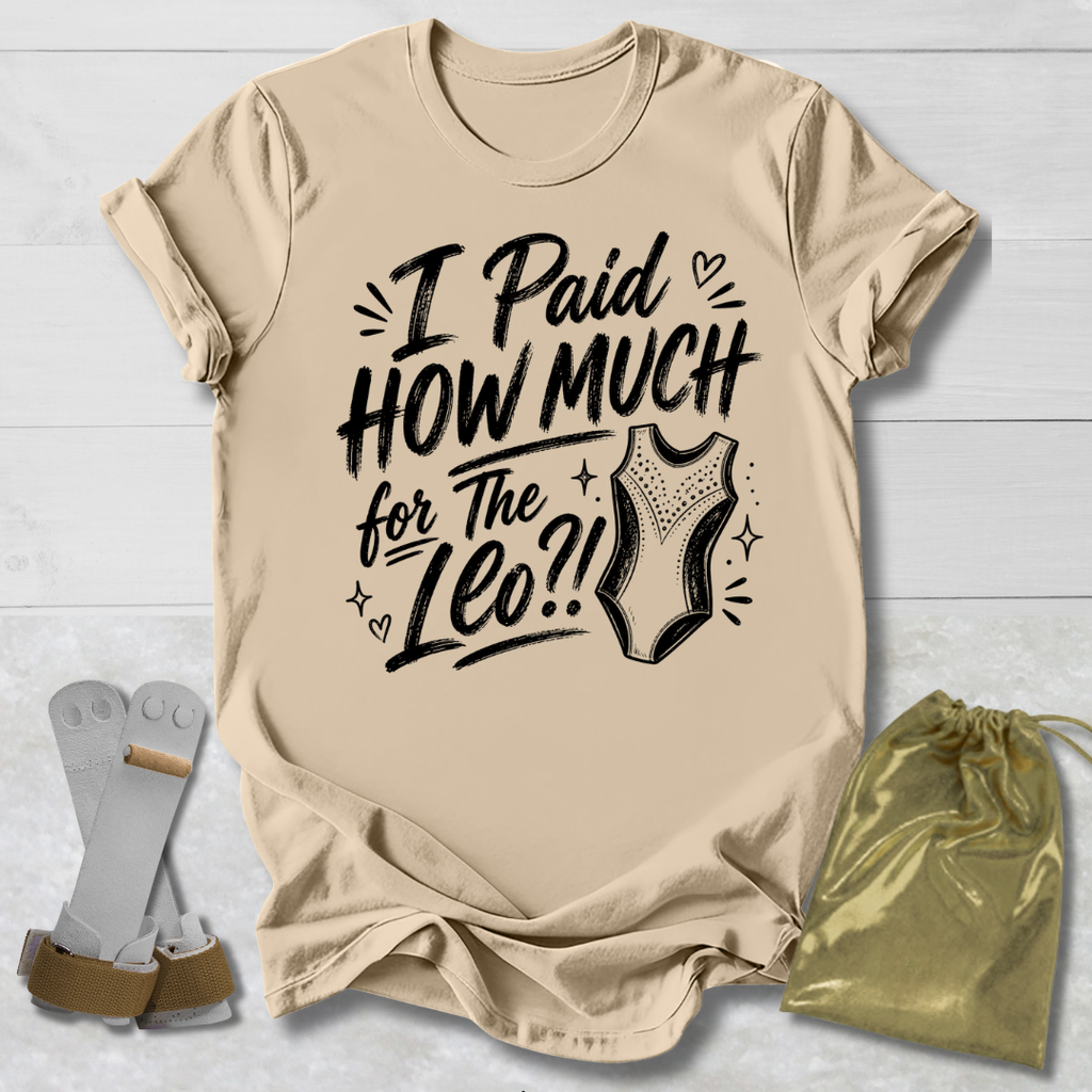 Beige t-shirt with I paid how much for the gymnastics leotard?!  text and graphic, socks, and drawstring bag on a light wooden surface