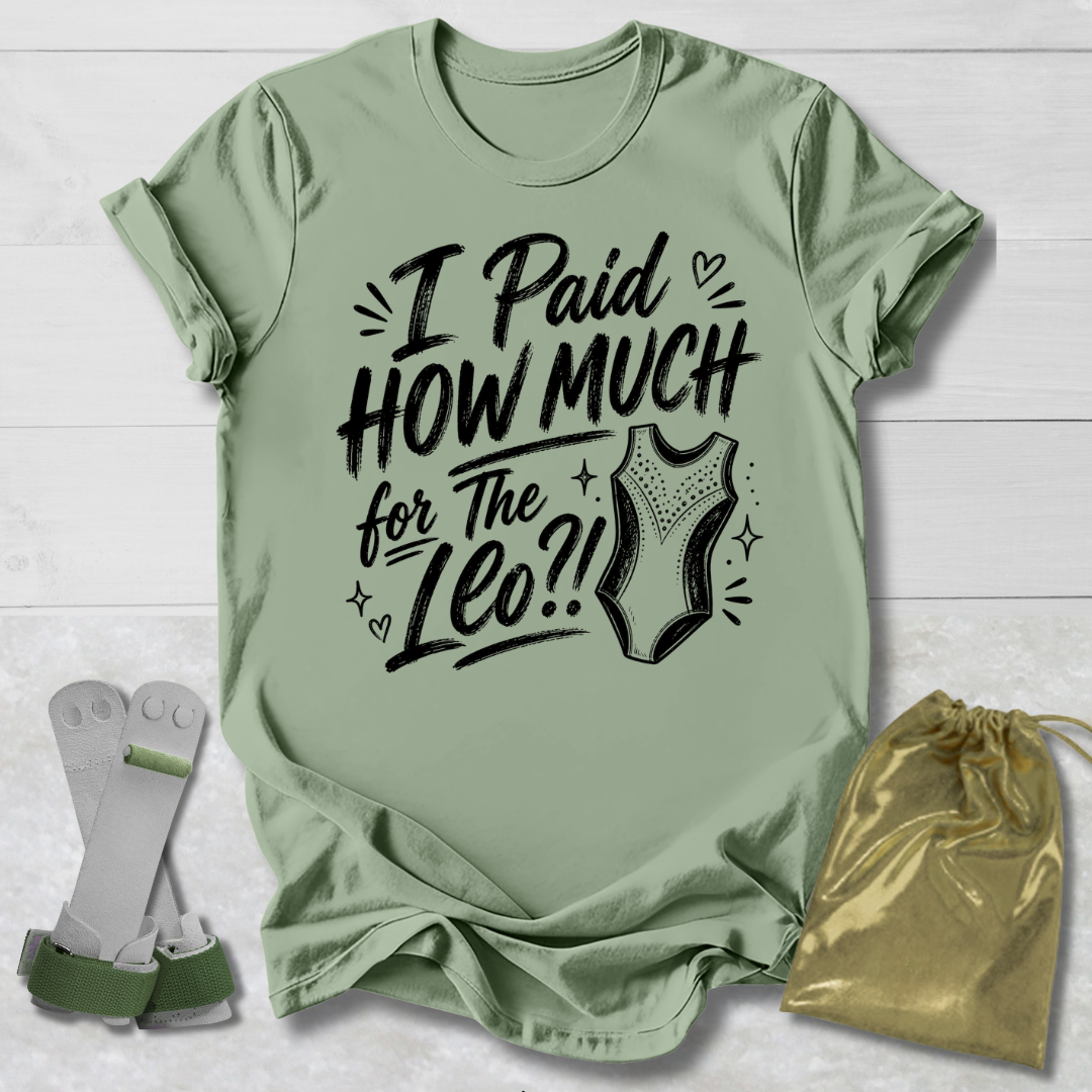 Green t-shirt with I paid how much for the gymnastics leotard?!  text and graphic, socks, and drawstring bag on a light wooden surface