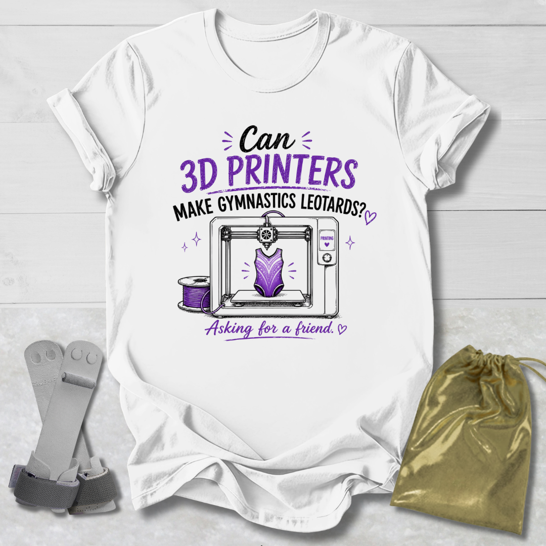 White t-shirt with a graphic and Can 3D Printers make gymnastics leotards text about 3D printers and gymnastics leotards on a light wooden surface.