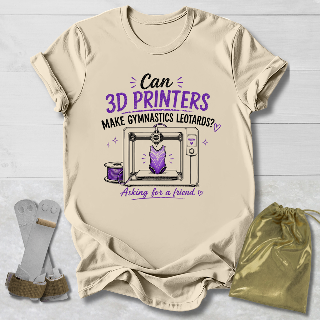 Beige t-shirt with a graphic and Can 3D Printers make gymnastics leotards text about 3D printers and gymnastics leotards on a light wooden surface.