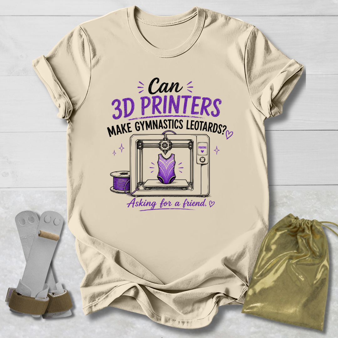 Beige t-shirt with a graphic and Can 3D Printers make gymnastics leotards text about 3D printers and gymnastics leotards on a light wooden surface.