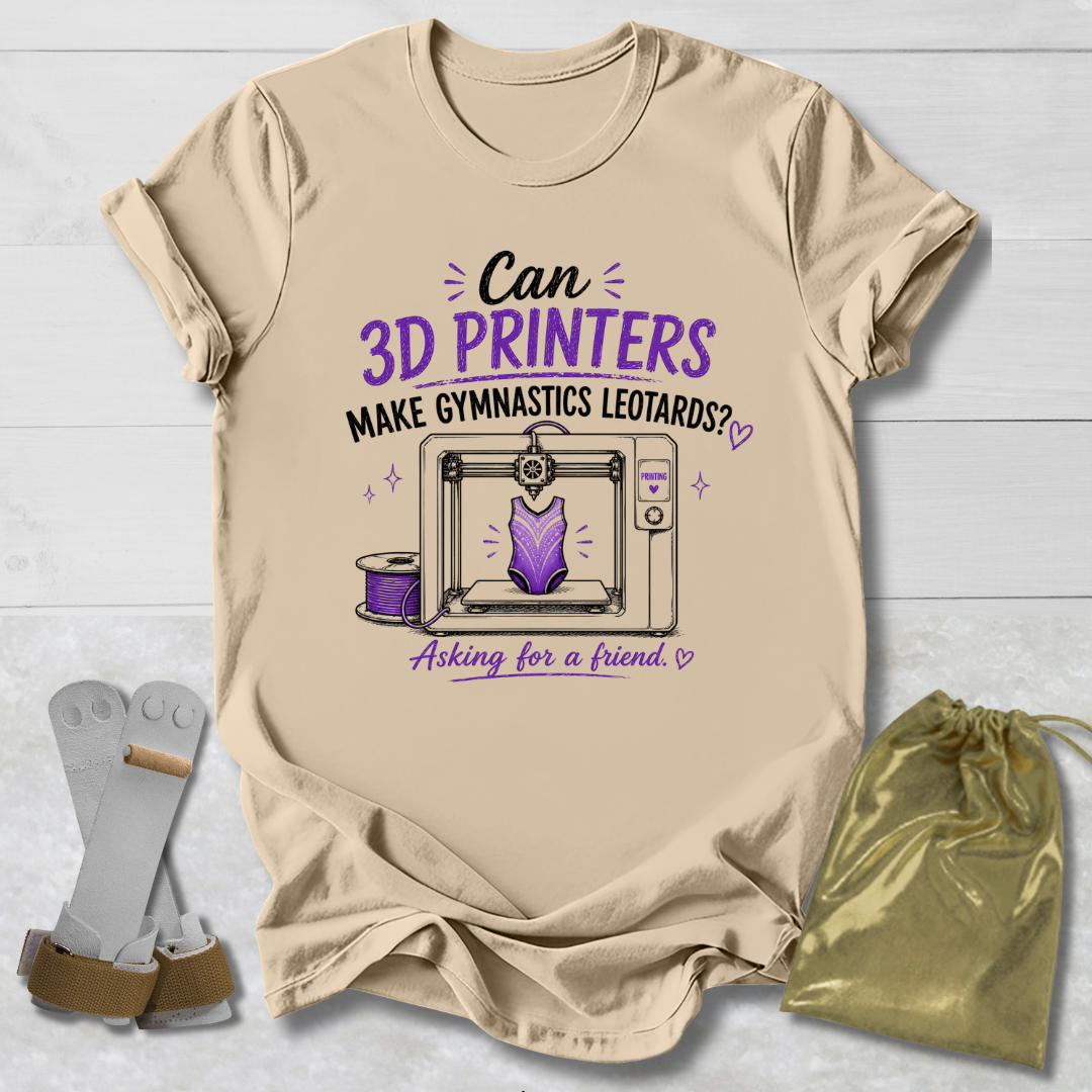 Beige t-shirt with a graphic and Can 3D Printers make gymnastics leotards text about 3D printers and gymnastics leotards on a light wooden surface.