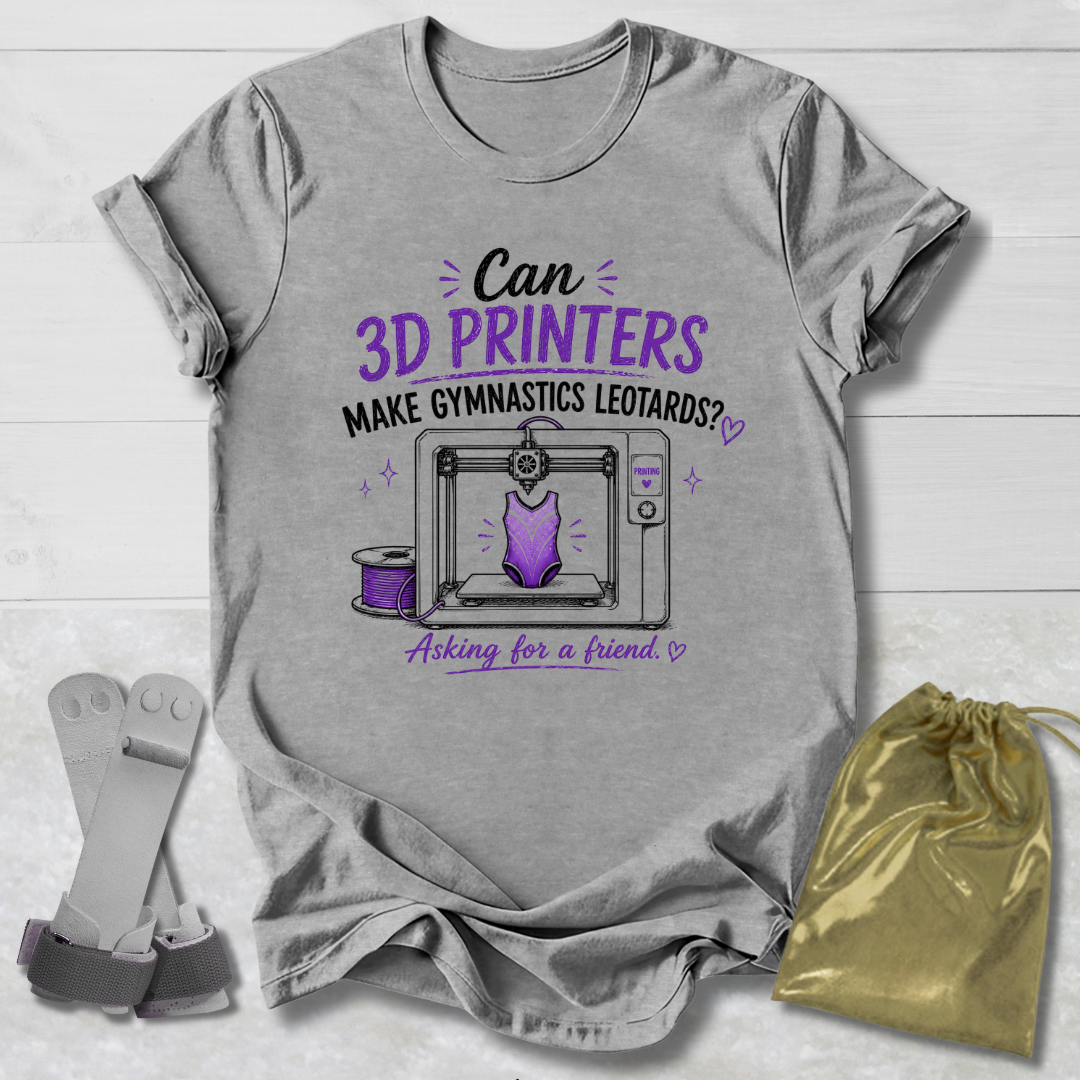Gray t-shirt with a graphic and Can 3D Printers make gymnastics leotards text about 3D printers and gymnastics leotards on a light wooden surface.