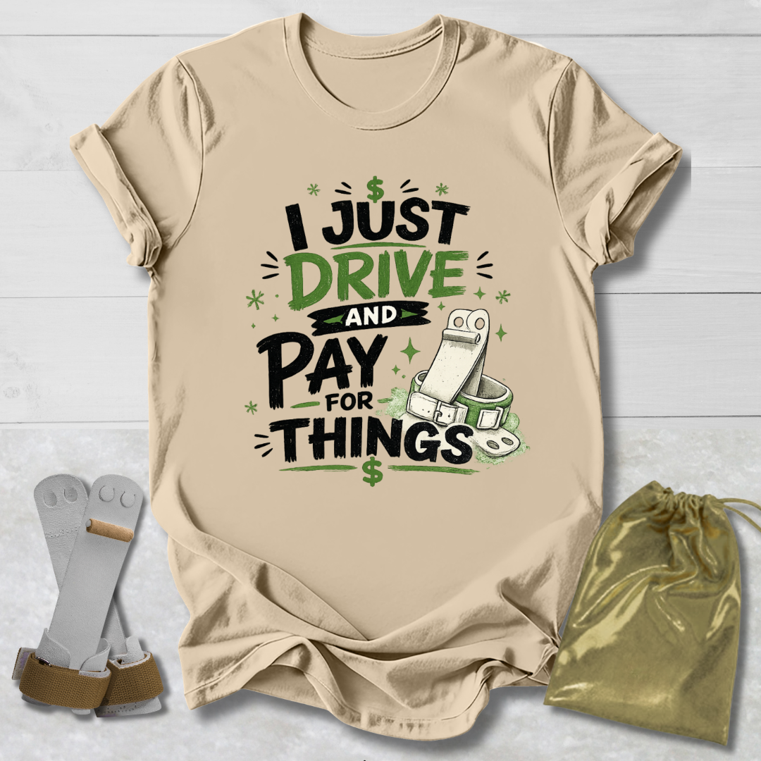 Beige t-shirt with humorous I drive and pay for things gymnastics mom and dad text design on a light wooden surface, accompanied by socks and a drawstring bag. 