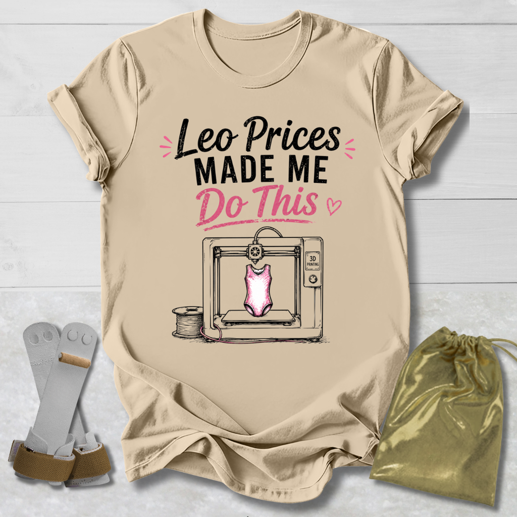 Beige t-shirt with graphic and Leotard prices made me do this gymnastics text on a light wooden surface, accompanied by socks and a drawstring bag.