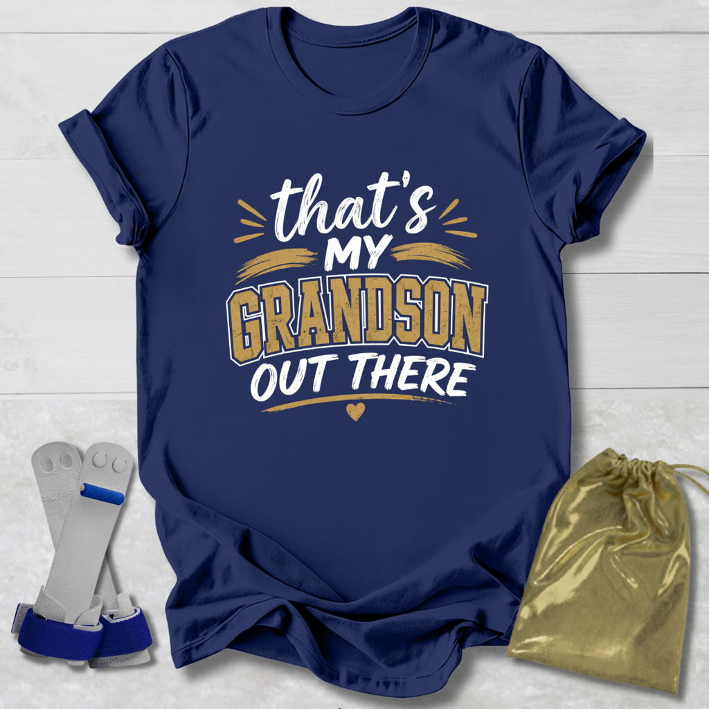 Navy blue t-shirt with 'that's my grandson out there' text, socks, and drawstring bag on a light wooden surface.