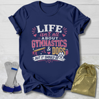 Navy blue t-shirt with colorful text design on a light wooden surface, accompanied by socks and a drawstring bag.