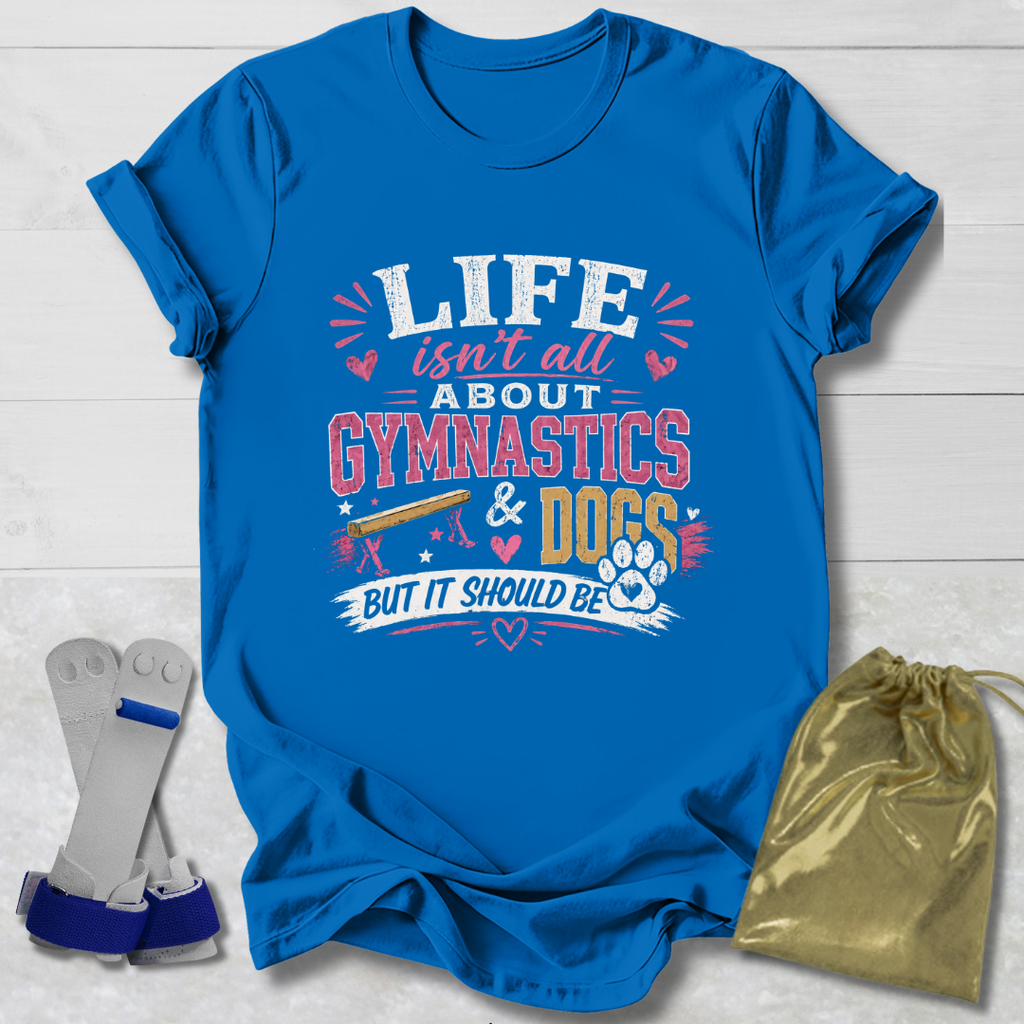 Blue t-shirt with 'Life isn't all about Gymnastics & Dogs but it should be' text on a wooden surface with socks and a drawstring bag.