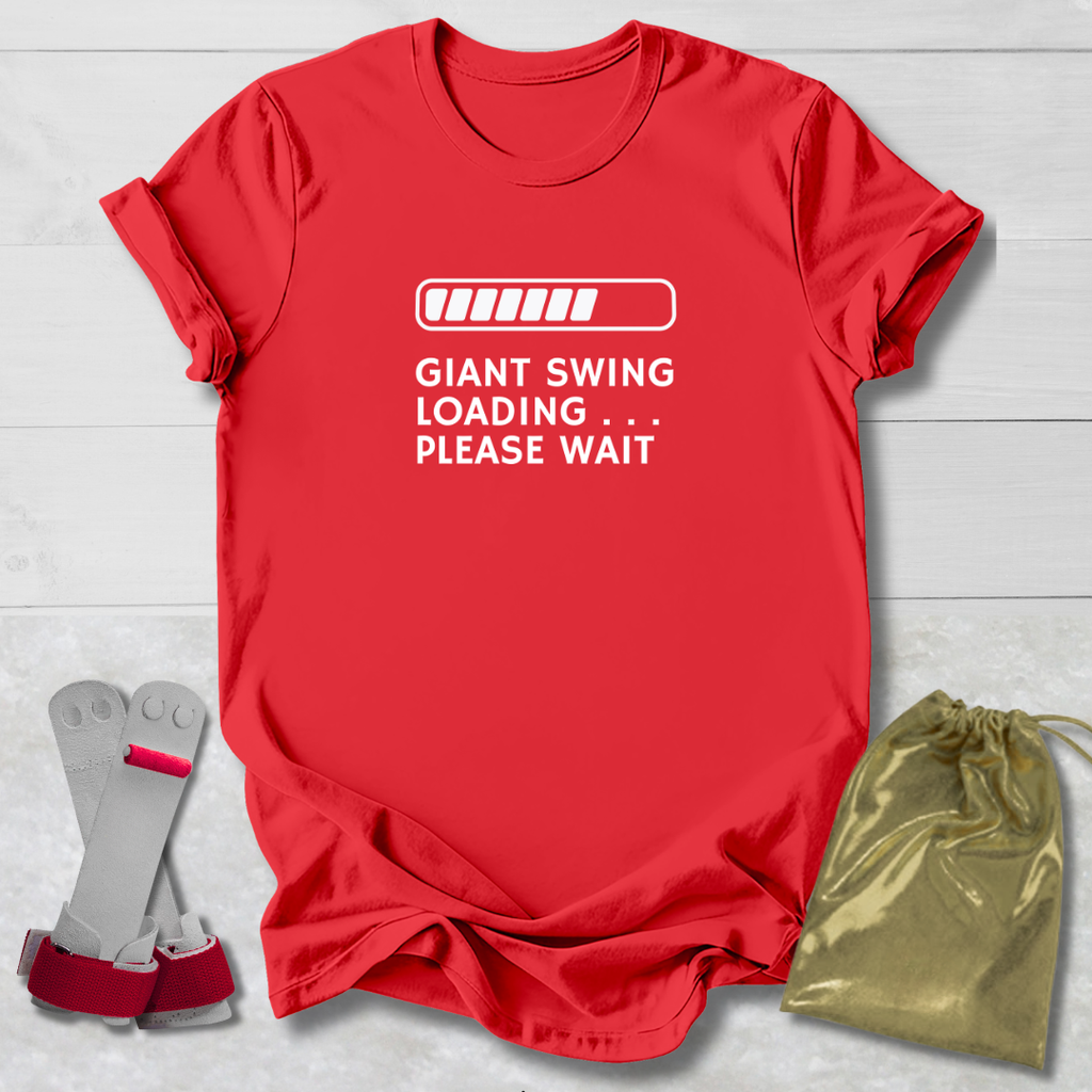 Red t-shirt with humorous text, socks, and drawstring bag on a light wooden surface