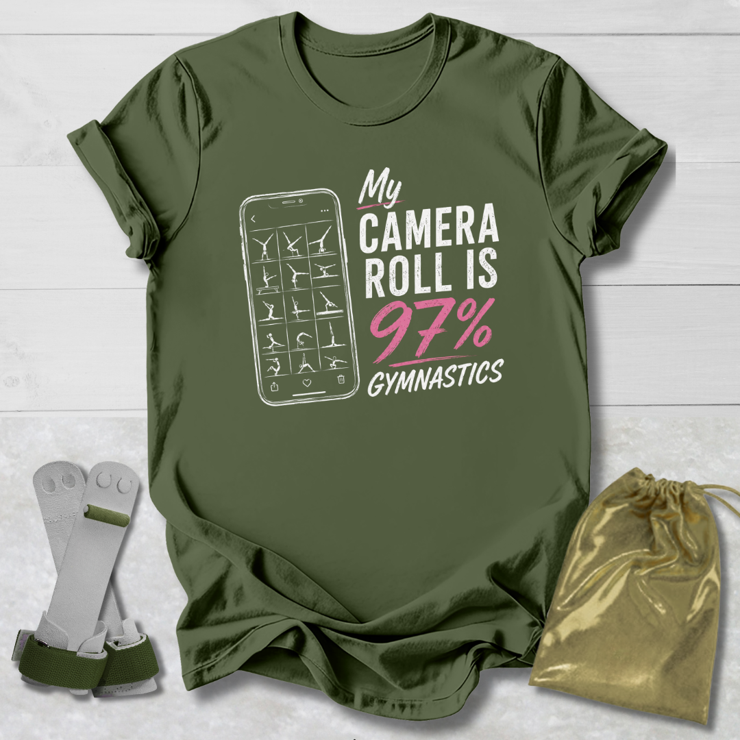 Green t-shirt with graphic and text on a light wooden surface, with socks and a drawstring bag in the foreground.