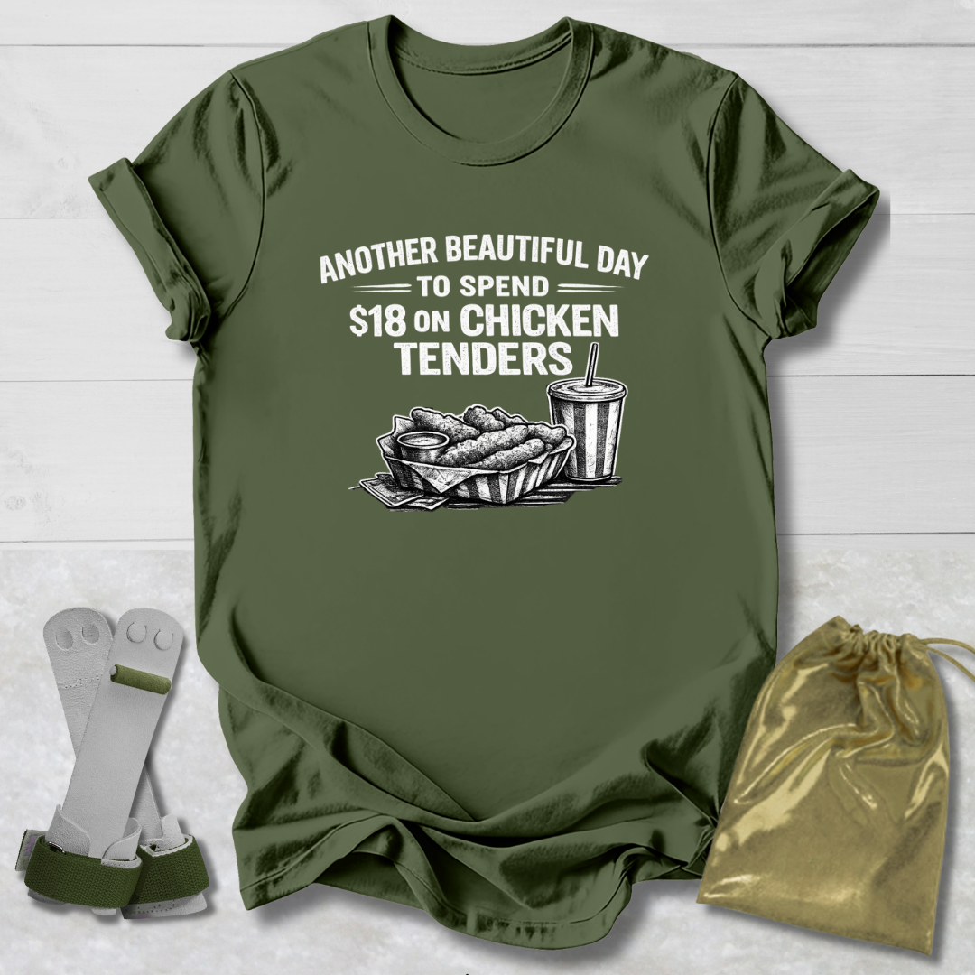 Green t-shirt with graphic and text on a wooden surface, with socks and a drawstring bag in the foreground.