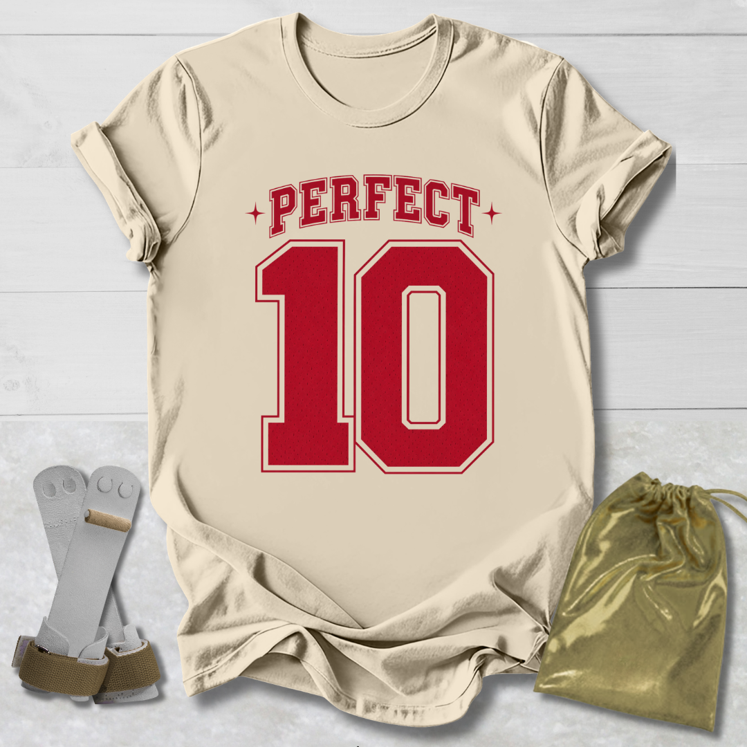 Beige t-shirt with red 'PERFECT 10' print, socks, and drawstring bag on a light wooden surface.