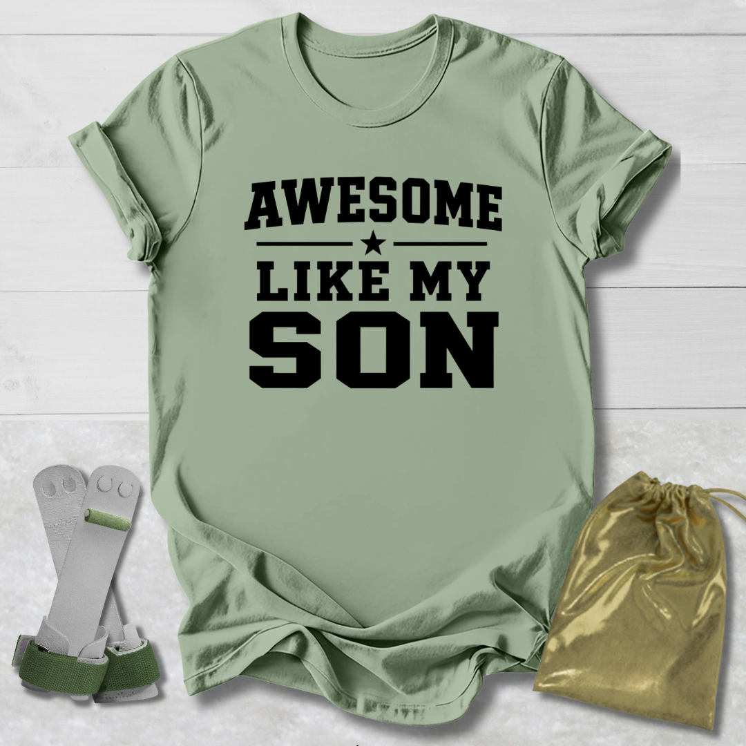 Green t-shirt with 'Awesome Like My Son' text, socks, and drawstring bag on a light wooden surface.
