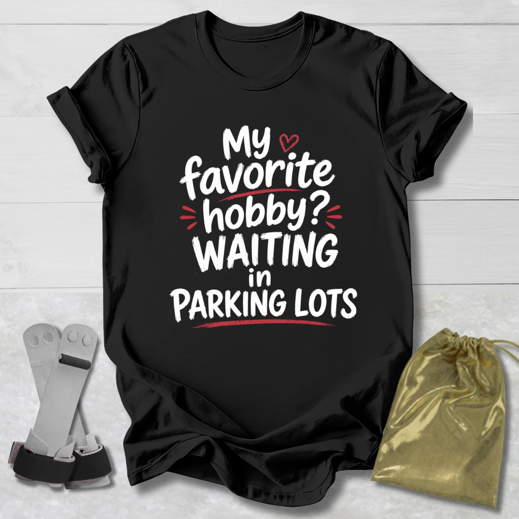Black t-shirt with humorous text design on a light wooden surface, accompanied by socks and a drawstring bag.