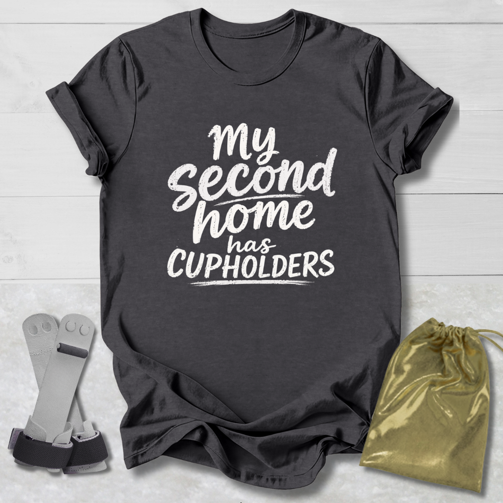 Dark gray t-shirt with 'My second home has cupholders' text, socks, and drawstring bag on a light wooden surface.