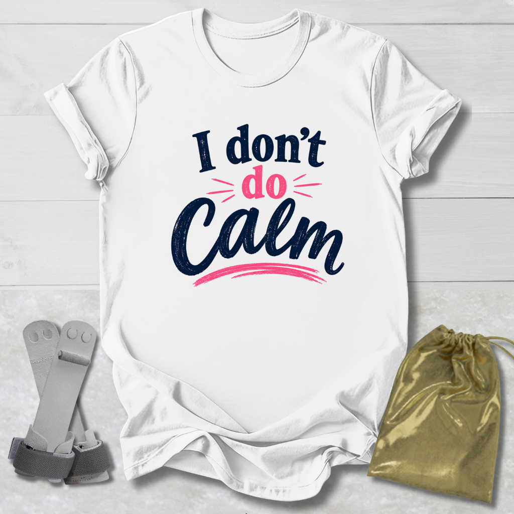 White t-shirt with 'I don't do Calm' text, socks, and drawstring bag on a light wooden surface
