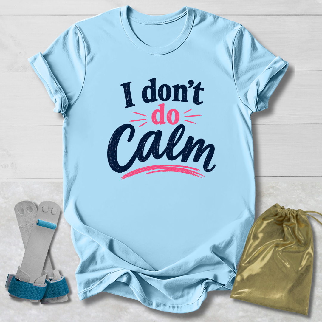 Light blue t-shirt with 'I don't do Calm' text, socks, and drawstring bag on a wooden surface