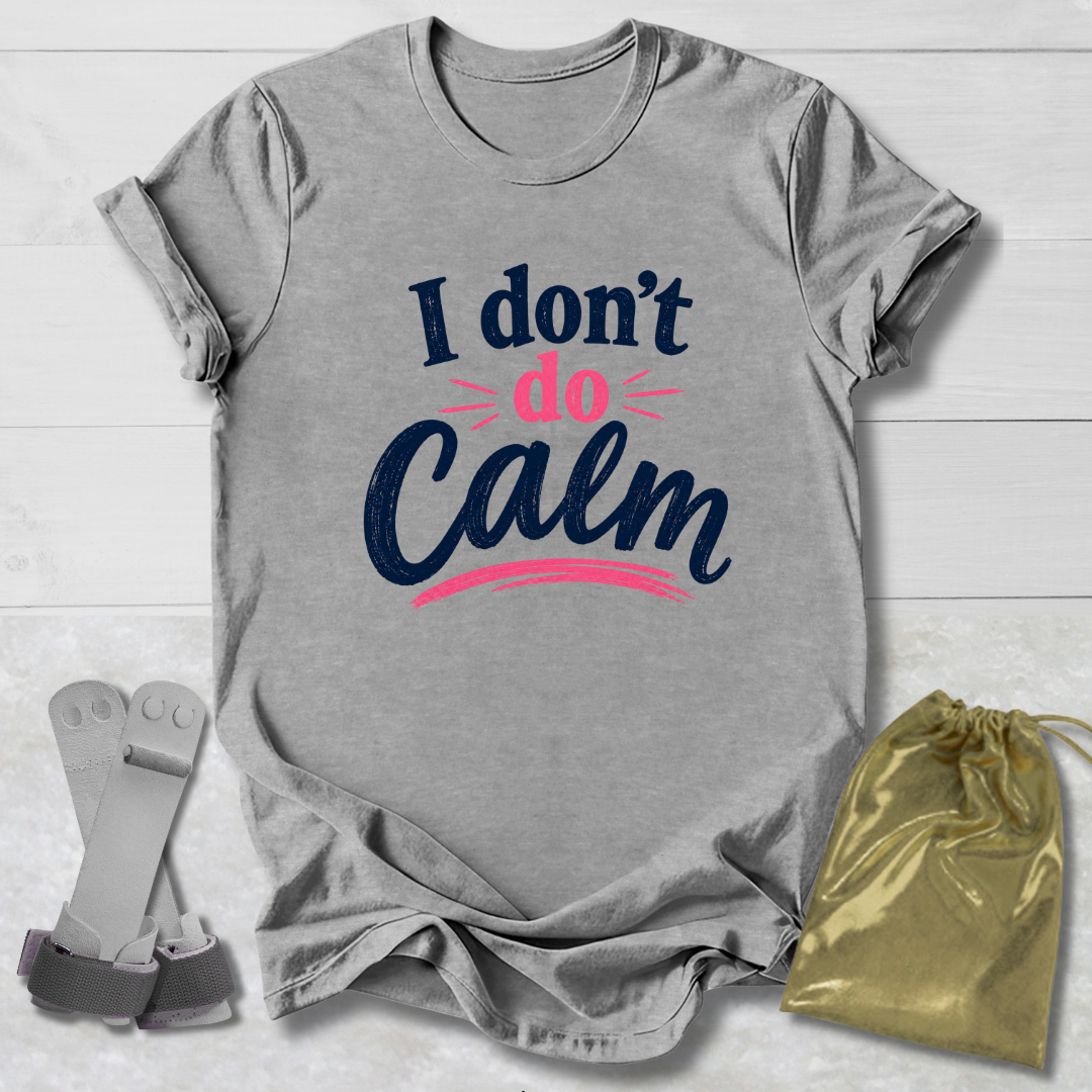 Gray t-shirt with 'I don't do Calm' text, socks, and drawstring bag on a light wooden surface
