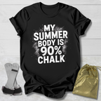 Black t-shirt with 'My Summer Body is 90% Chalk' text on a light wooden surface.