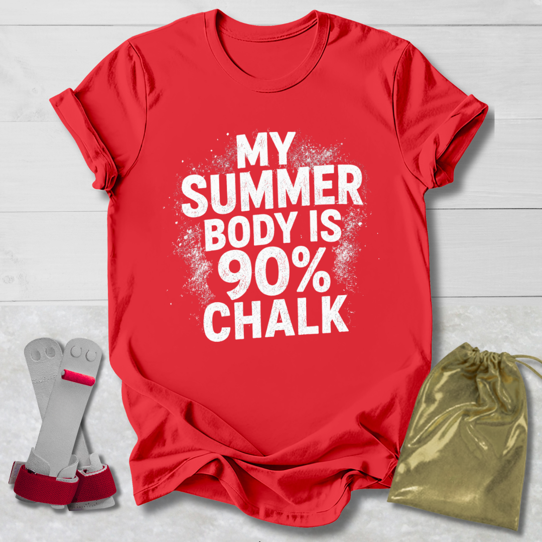 Red t-shirt with 'My Summer Body is 90% Chalk' text, socks, and drawstring bag on a light wooden surface.