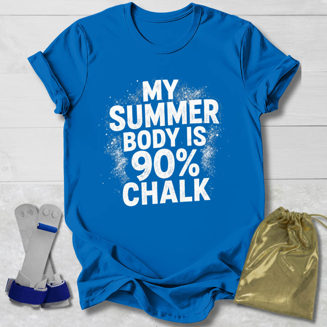 Blue t-shirt with 'My Summer Body is 90% Chalk' text on a light wooden surface, with socks and a drawstring bag in the foreground.
