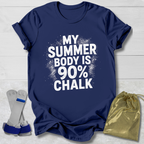 Navy blue t-shirt with 'My summer body is 90% chalk' text on a light wooden surface.