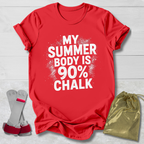 Red t-shirt with 'My Summer Body is 90% Chalk' text, socks, and drawstring bag on a light wooden surface.