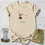 Beige t-shirt with gymnast design and text, socks, and drawstring bag on a light wooden surface