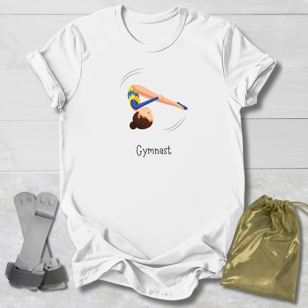 White t-shirt with gymnast graphic and 'Gymnast' text, socks, and drawstring bag on a light wooden surface