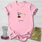 Pink t-shirt with gymnast design and 'Gymnast' text, paired with socks and a drawstring bag on a light wooden surface.