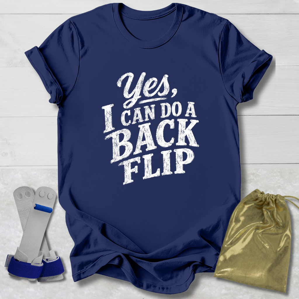 Navy blue t-shirt with 'Yes, I can do a back flip' text on a light wooden surface.