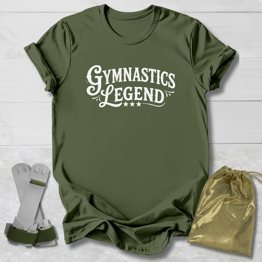 Green t-shirt with 'Gymnastics Legend' text, socks, and drawstring bag on a light wooden surface.