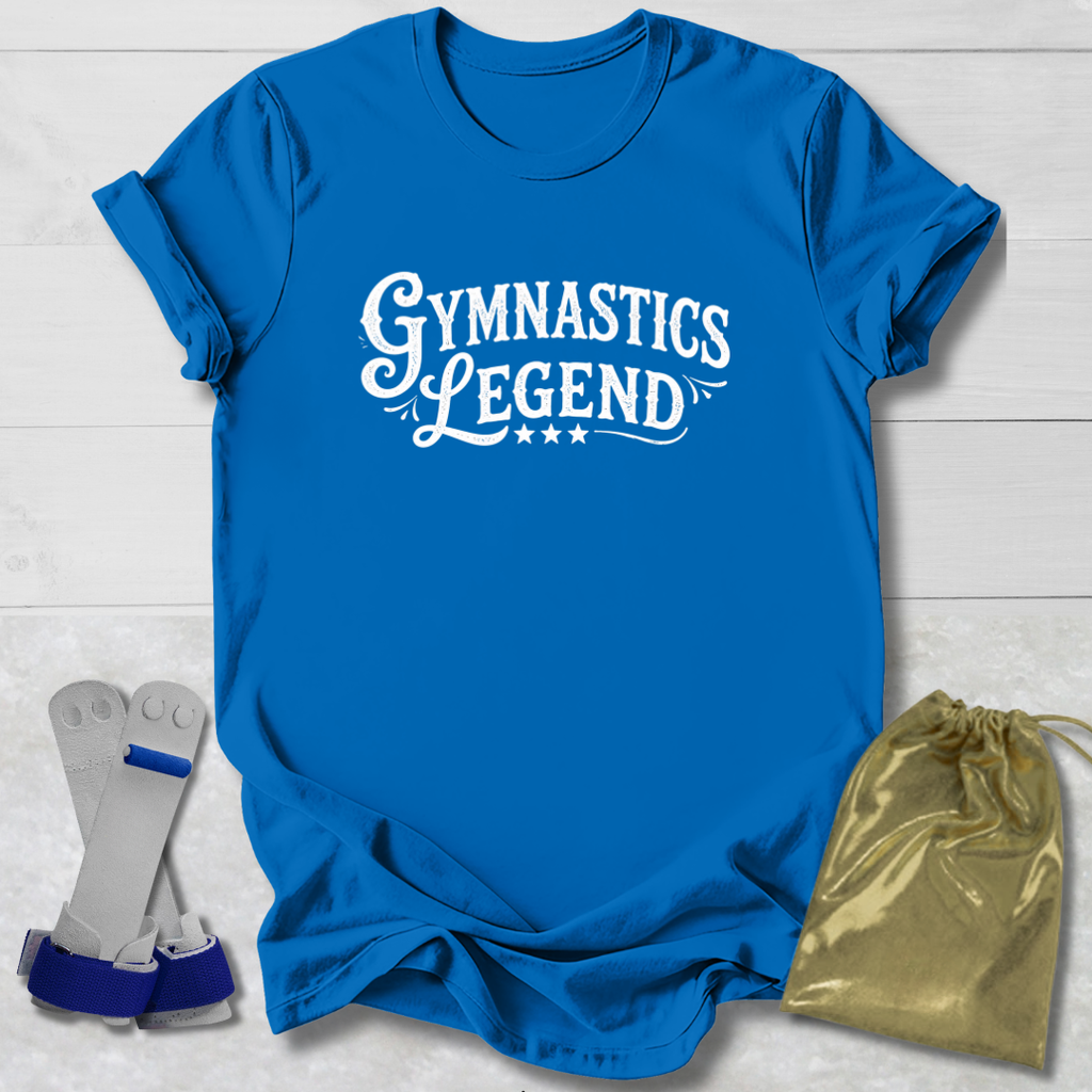 Blue t-shirt with 'Gymnastics Legend' text, socks, and drawstring bag on a light wooden surface