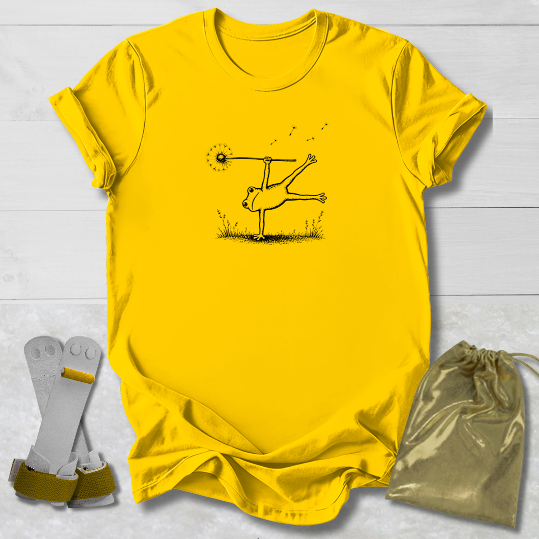 Yellow t-shirt with a graphic design on a light wooden surface