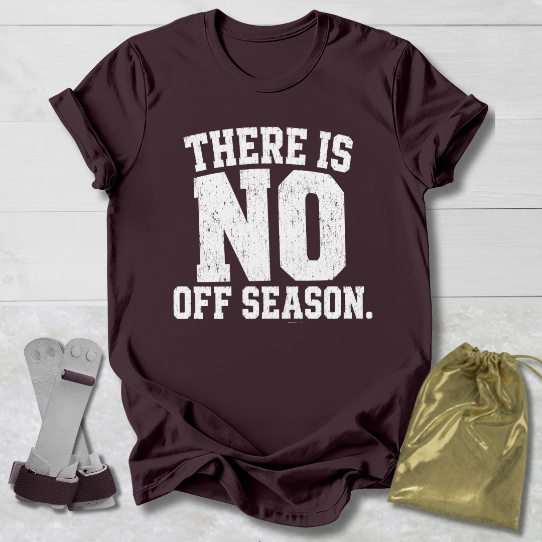 Maroon t-shirt with 'There is no off season' text, socks, and drawstring bag on a light wooden surface.