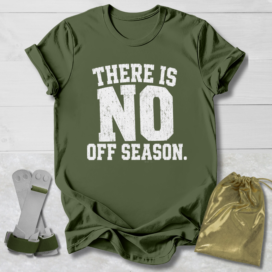 Green t-shirt with 'There is no off season' text, socks, and drawstring bag on a light wooden surface.
