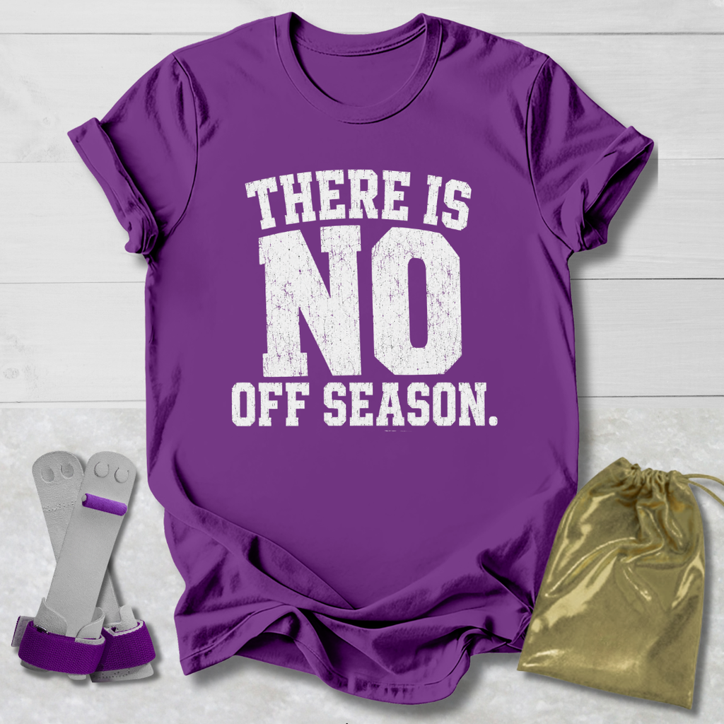 Purple t-shirt with 'There is no off season' text, socks, and drawstring bag on a light wooden surface.