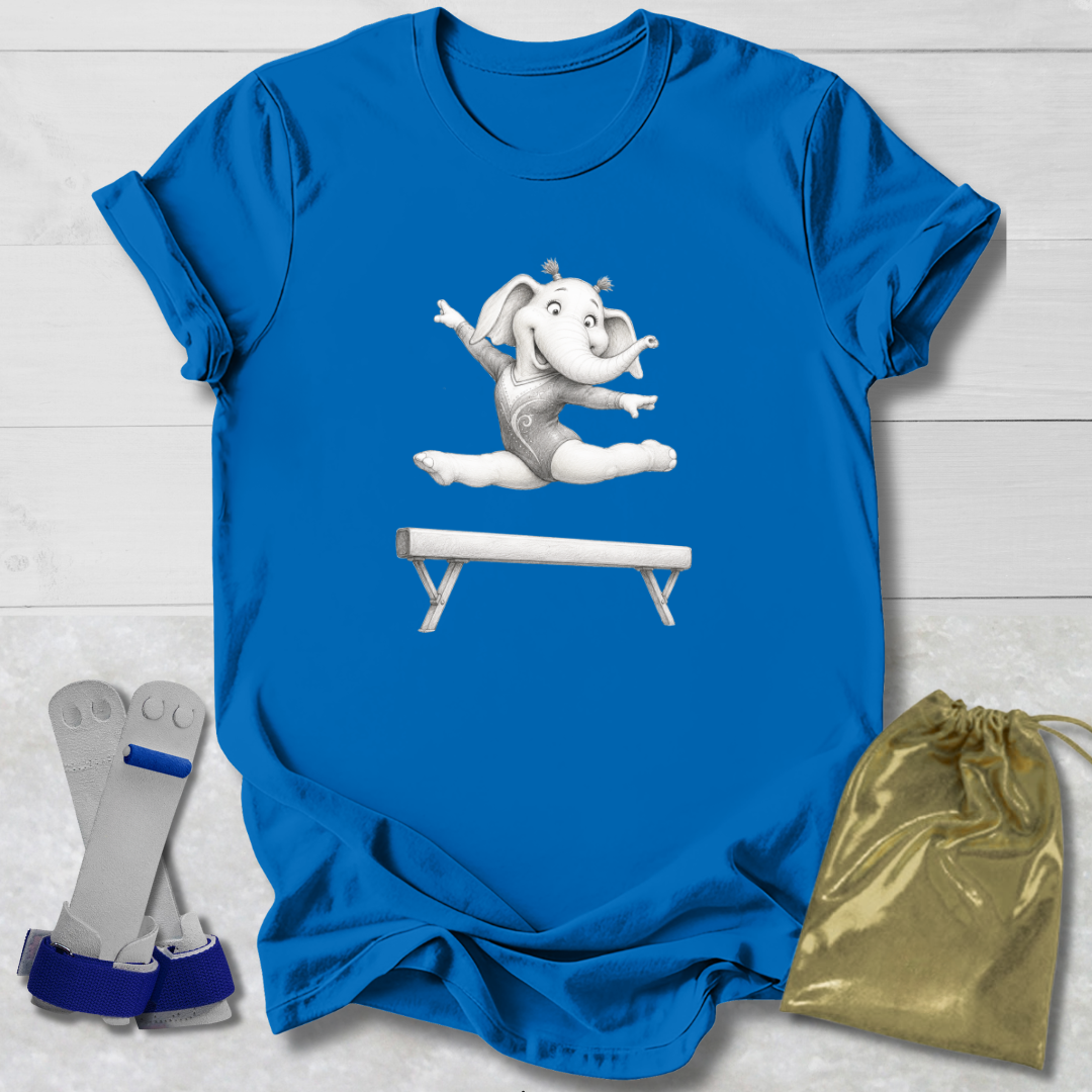 Blue t-shirt with a cartoon elephant on a balance beam, socks, and a drawstring bag on a light wooden surface.