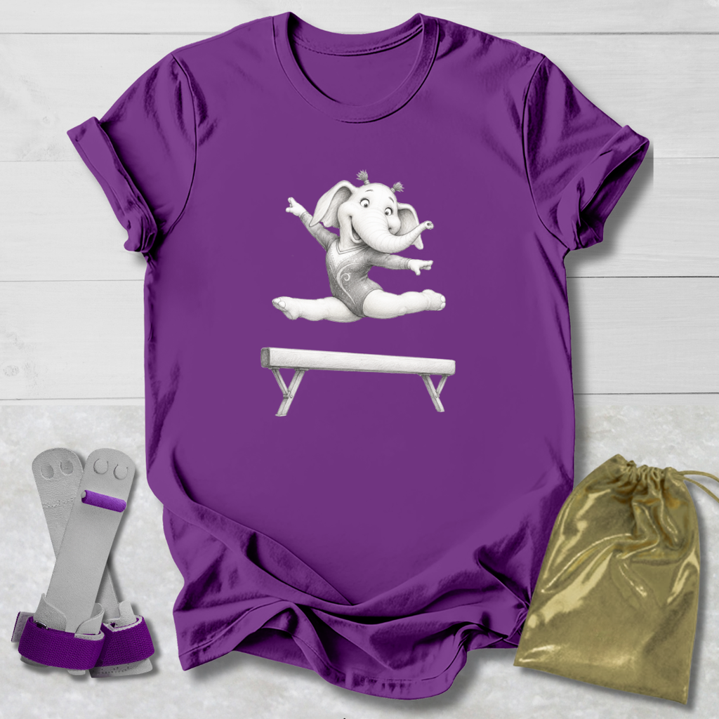 Purple t-shirt with a cartoon elephant on a balance beam, socks, and a drawstring bag on a light wooden surface.