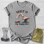 Gray t-shirt with graphic design and accessories on a light wooden surface