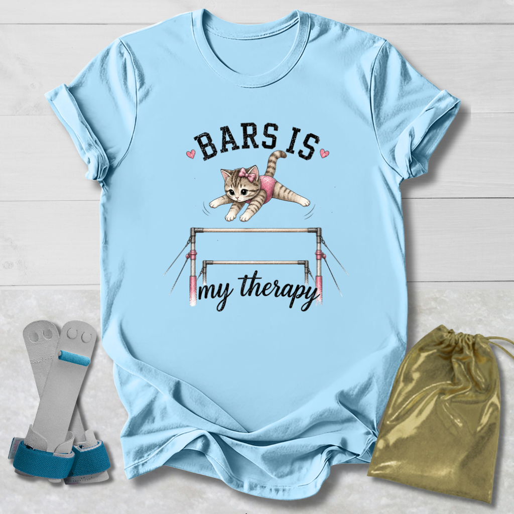 Light blue t-shirt with a graphic of a cat on bars and text, displayed with socks and a drawstring bag.