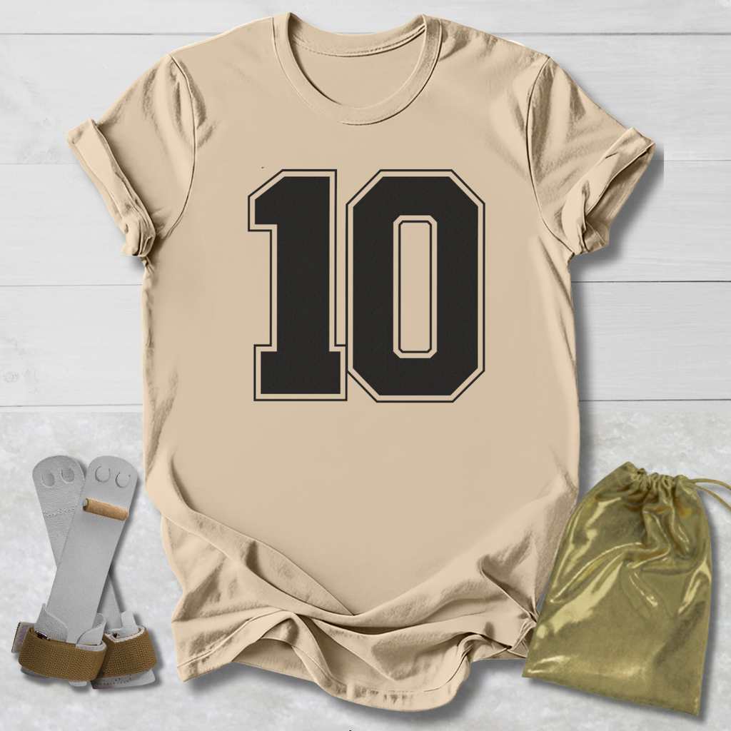 Beige t-shirt with number 10, socks, and drawstring bag on a light wooden surface