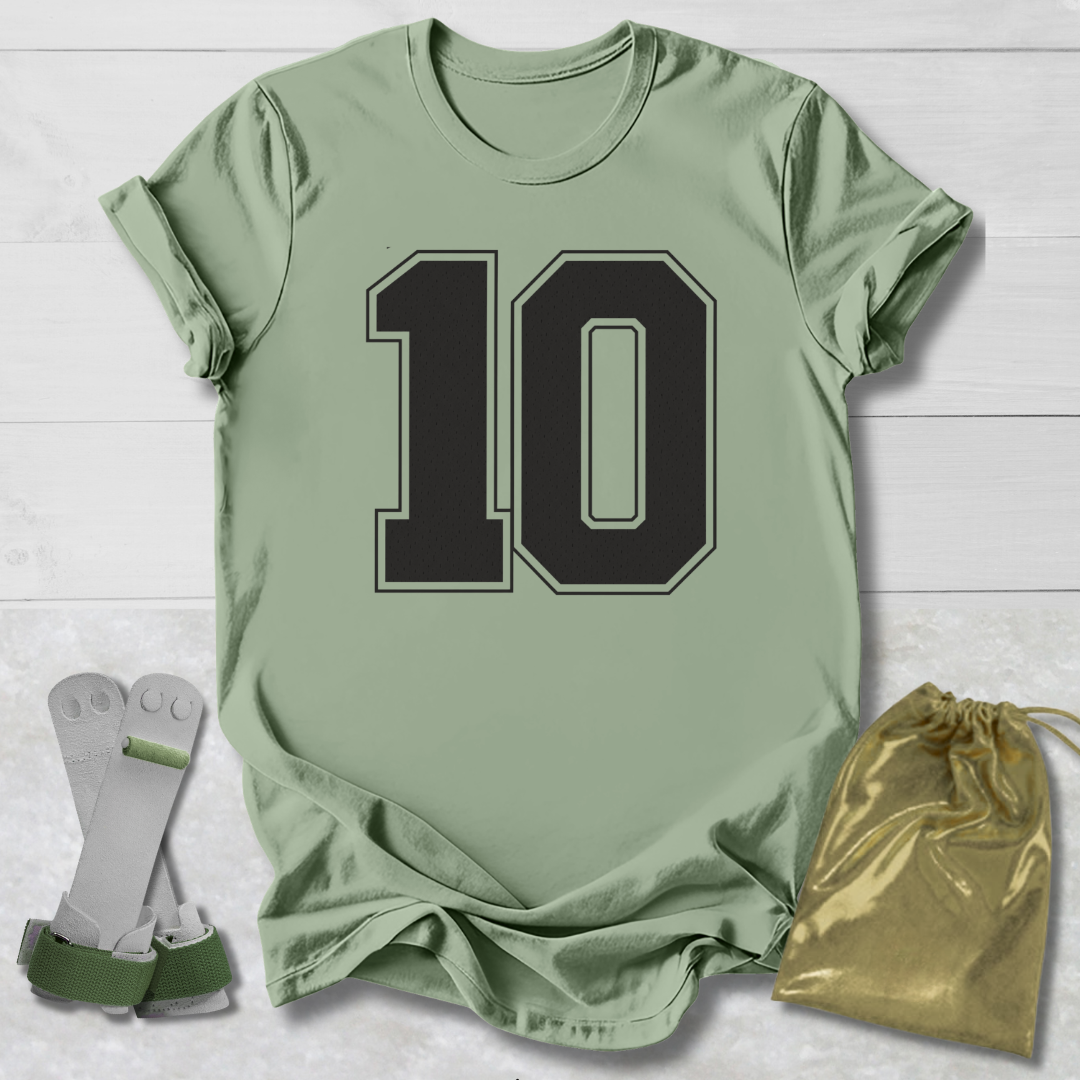 Green t-shirt with number 10, socks, and drawstring bag on a light wooden surface