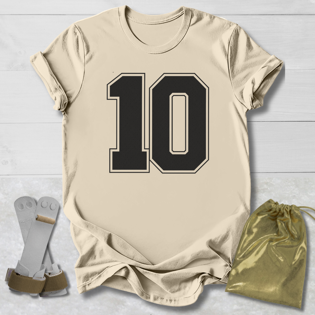 Beige t-shirt with number 10, socks, and drawstring bag on a light wooden surface