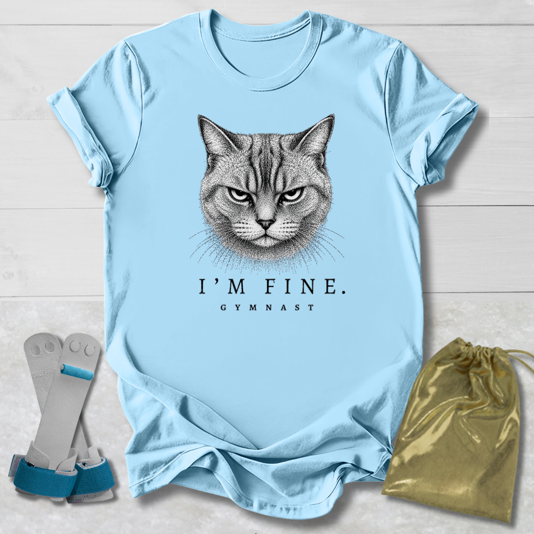 Light blue t-shirt with a cat graphic and text, displayed with socks and a drawstring bag on a light wooden surface.