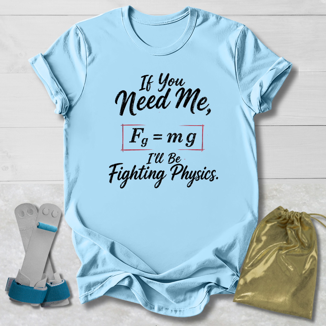 Light blue t-shirt with physics-themed text, socks, and drawstring bag on a light wooden surface.